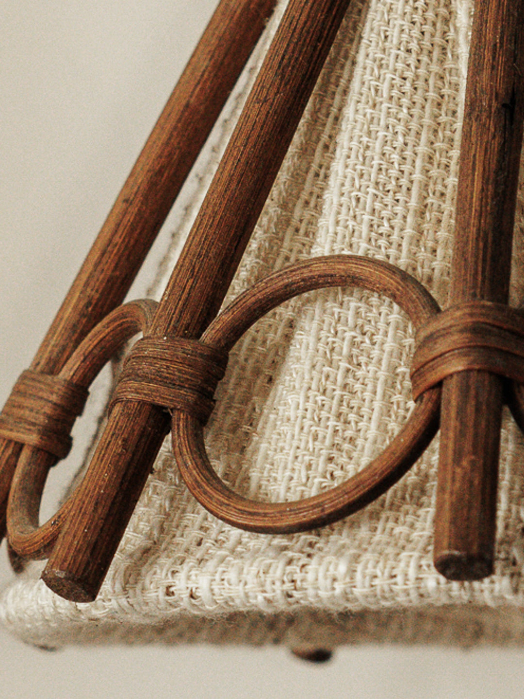 a close up of a lampshade with a wooden frame