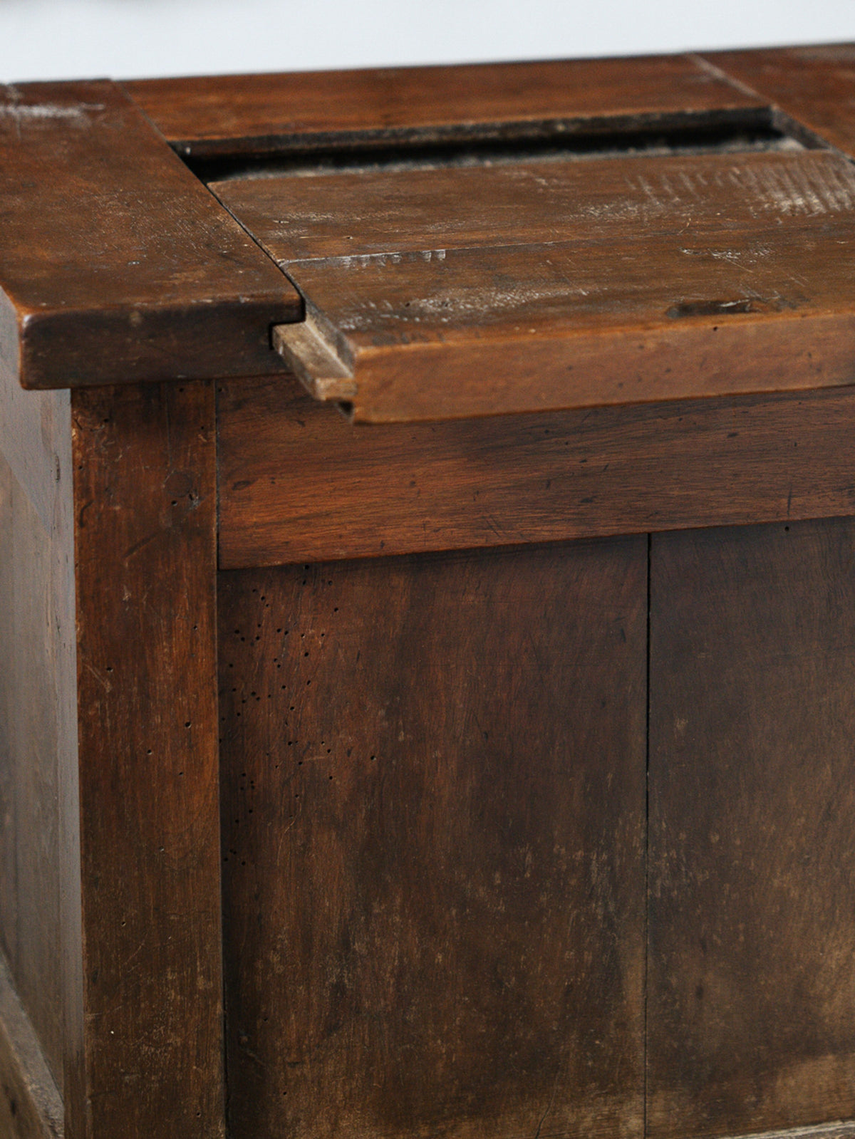 a close up of a wooden salt box with a top that opens.