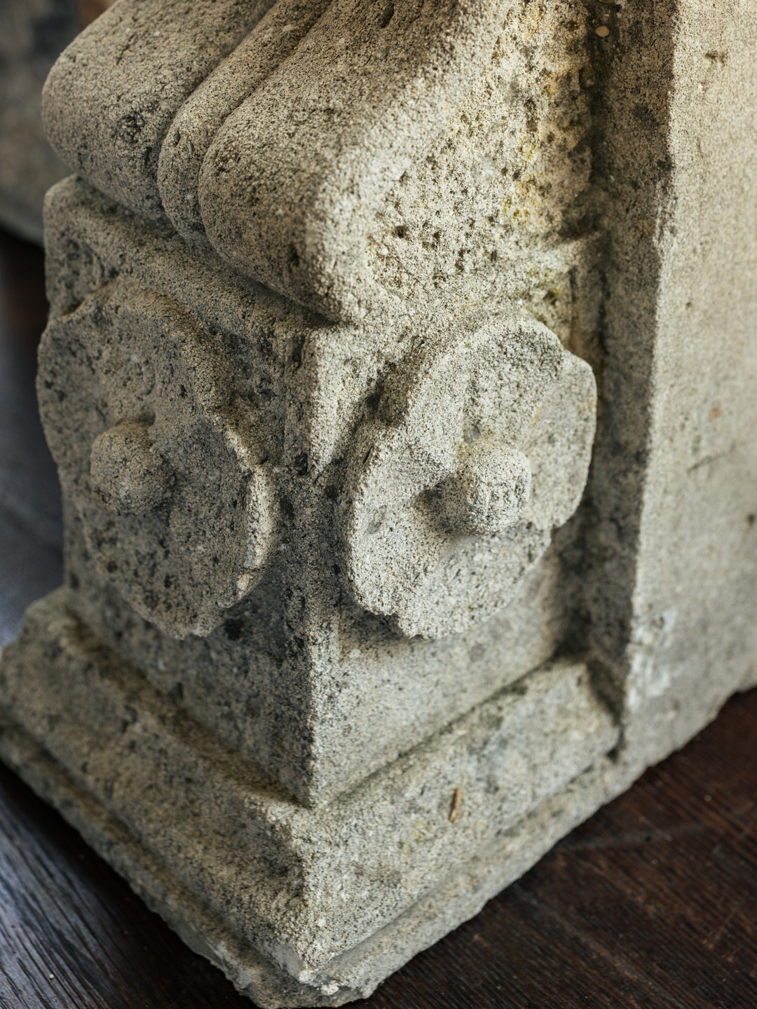 a close up of a stone sculpture on a wooden table