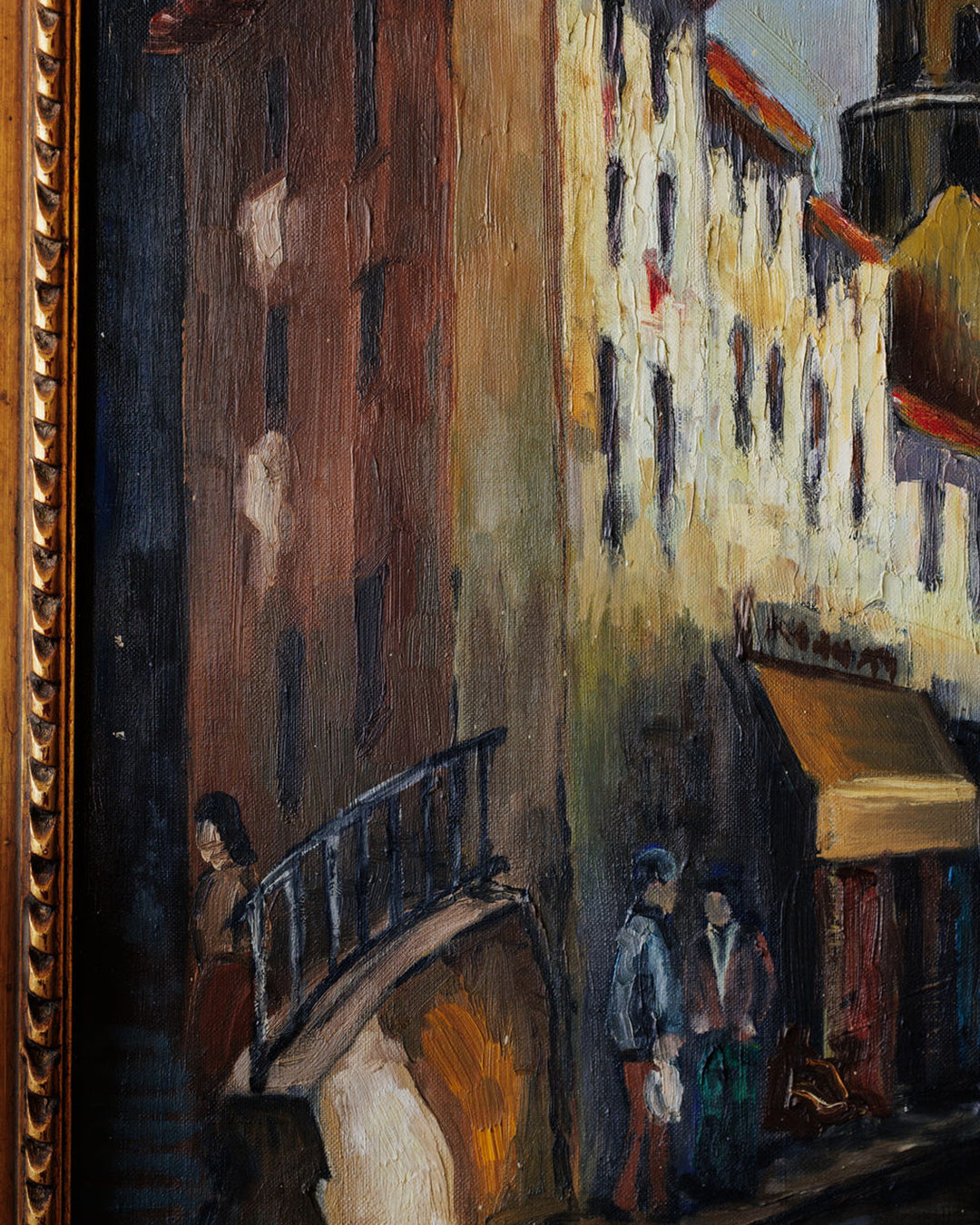 Oil painting of a narrow European street scene with tall buildings, an arched bridge, and figures, presented in a painterly style.