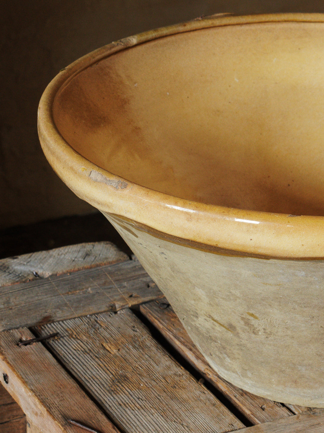 a large bowl is sitting on a wooden table